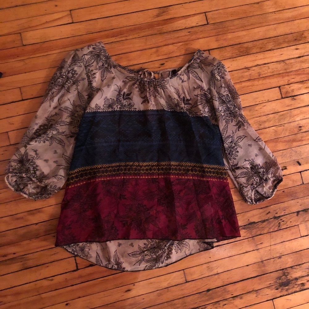 Cream, blue, red blouse